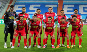 عکس / حضور وزیر در استادیوم با لباس پرسپولیس!